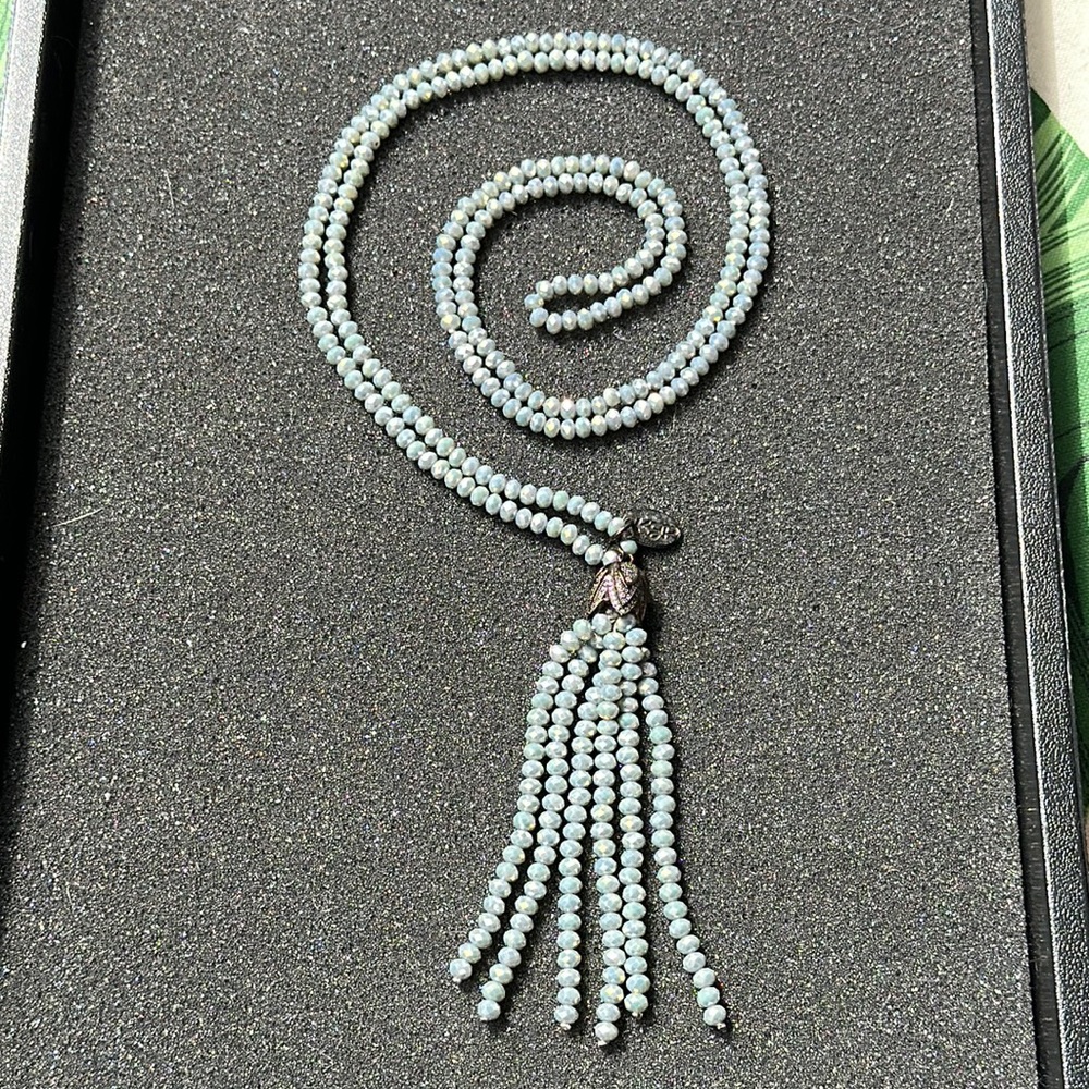 Blue long beaded tassel swing necklace. Gunmetal detail with crystals.